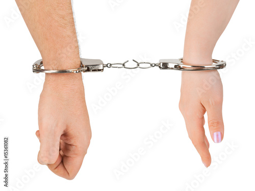 Man and woman hands and breaking handcuffs photo