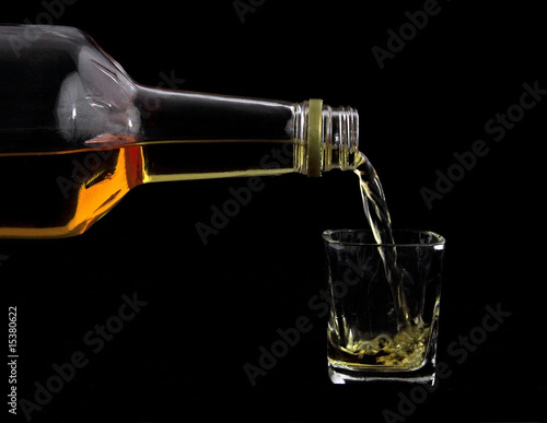 Scotch pouring into glass