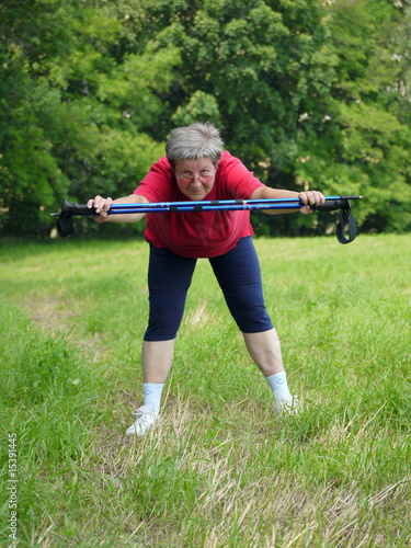 Senior woman doing a series of warm-up exercises