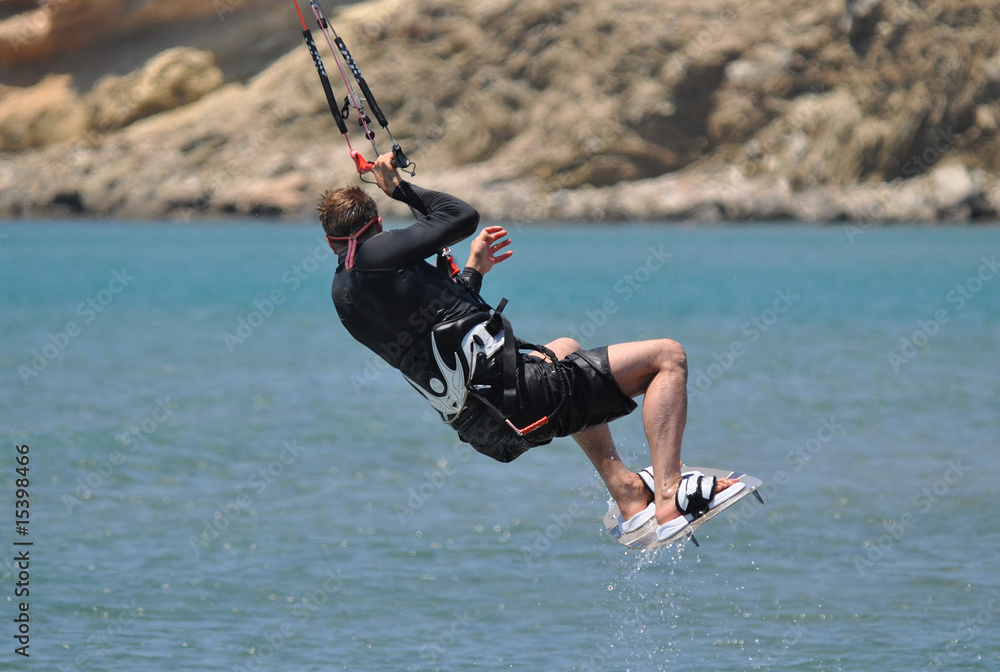 kitesurfer performing a jump