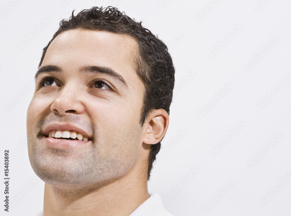 Obraz premium Attractive Man Looking Up and Smiling