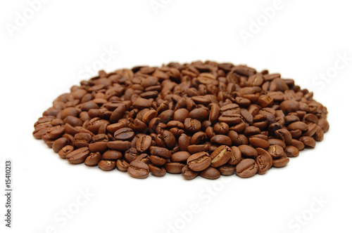 hill of coffee grains over white