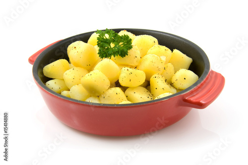 red pan with fresh baked potatoes