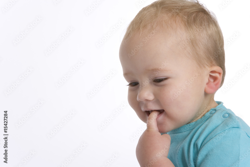 Portrait of a cool toddler boy with a finger in his mouth Portrait of a cool toddler boy with a finger in his mouth