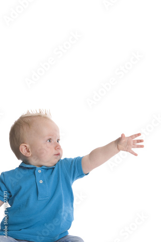 Toddler boy is reaching out