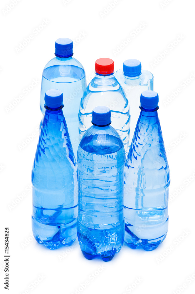 Bottles of water isolated on the white Bottles of water isolated on the white