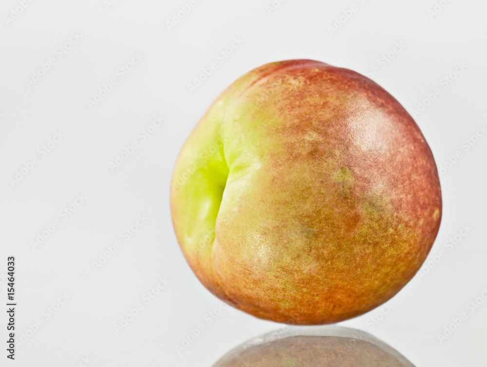 Fresh peach fruit reflected on the table Fresh peach fruit reflected on the table