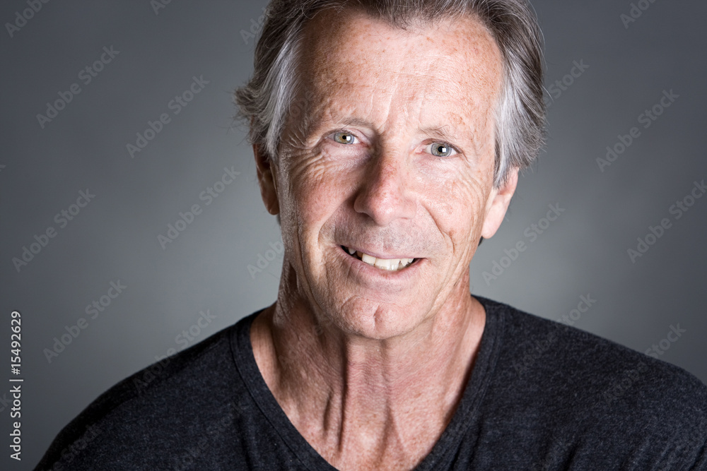 Handsome Senior Man against a Grey Background Handsome Senior Man against a Grey Background