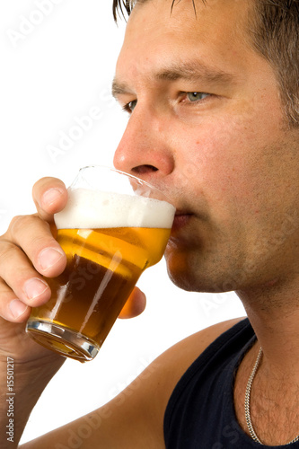 Man drinks beer over white background