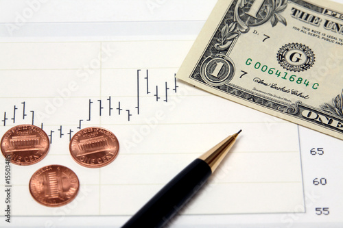 Stock chart US money dollar currency bill and new pennies