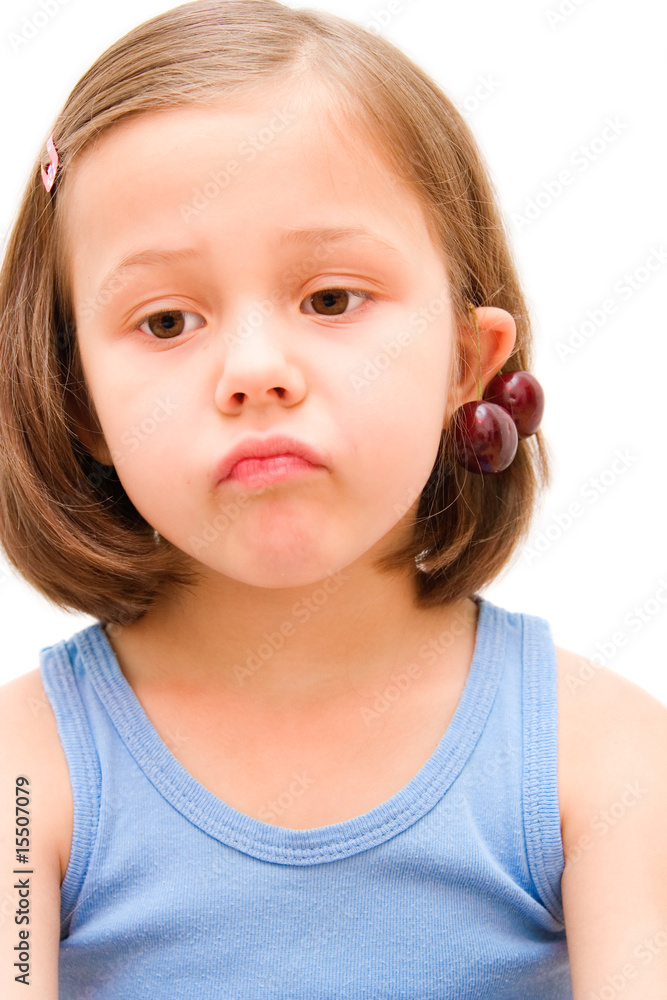 5 years old girl with cherries isolated on white