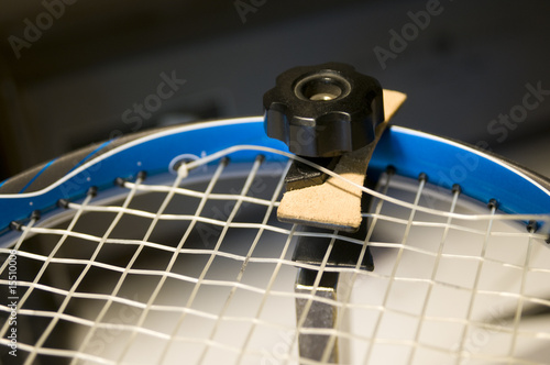 tennis racquet restring job on machine photo