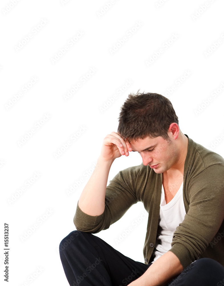 Depressed man sitting on the floor Depressed man sitting on the floor