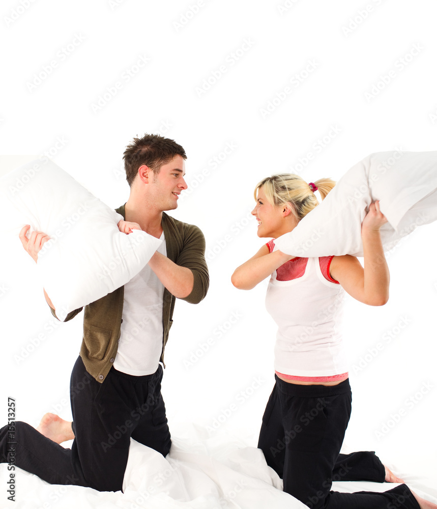 Boyfriend and girlfriend having a pillow fight Boyfriend and girlfriend having a pillow fight