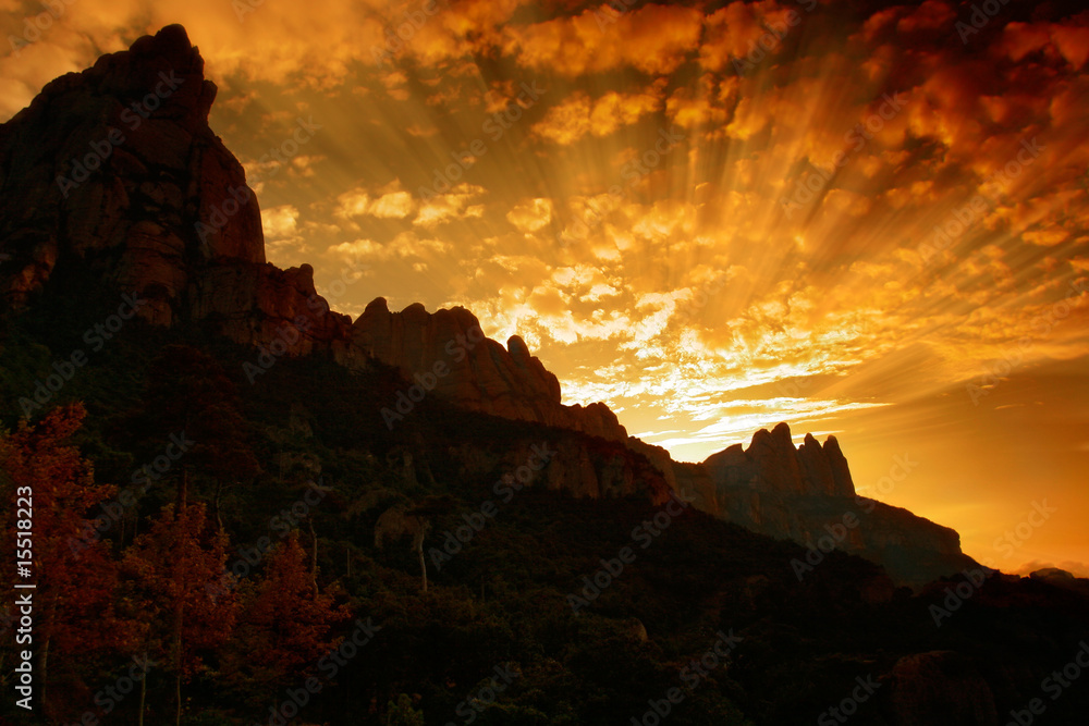 Montserrat mountain  sunset with rays