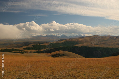 steppe landscape with mountains at the background