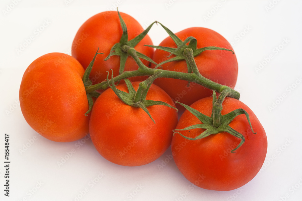 Five tomatoes isolated