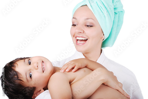 Young mother and her son after taking a bath