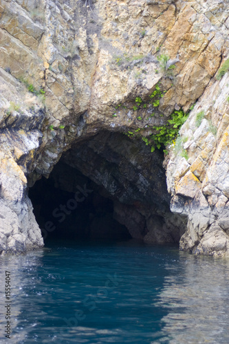 grotto in the rock, view by sea