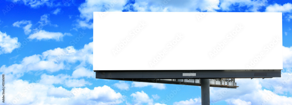 Fototapeta premium Blank billboard against blue sky