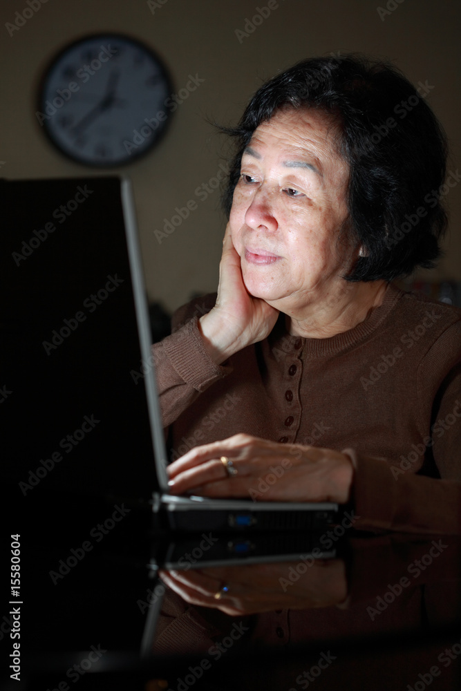 senior asian lady working late senior asian lady working late