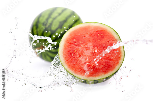 water splashing on watermelon half