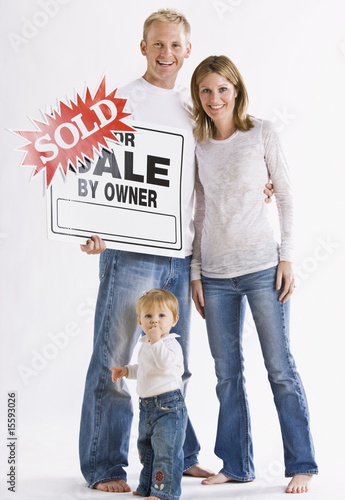 Family in Front of Sign photo