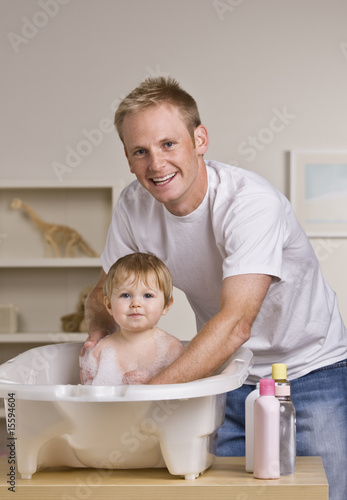 Father Giving Daughter a Bath