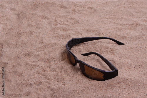 Sunglasses in sand