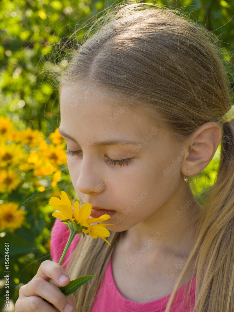 Girl Smelling Flower