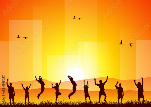 Happy people jumping at sunset