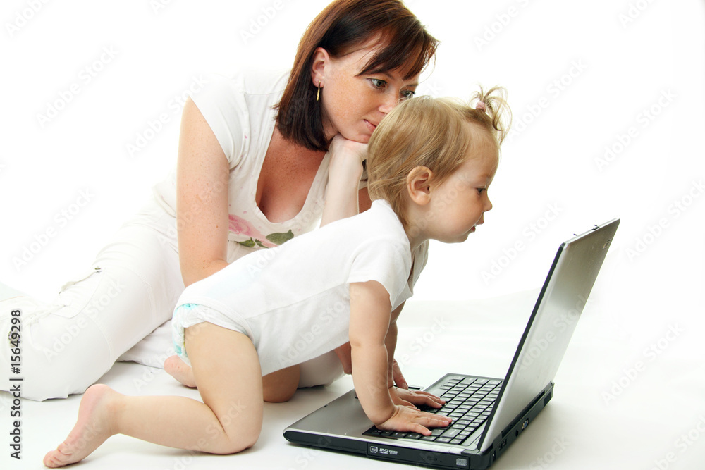 Mother and baby with laptop isolated on white