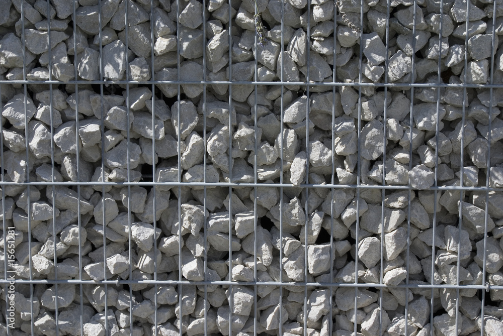 Obraz premium Steine hinter Gitter