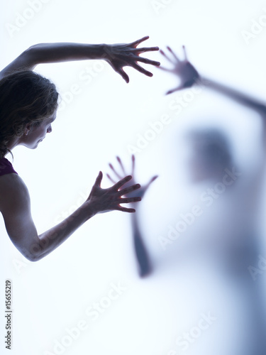 Two people reaching out to each other