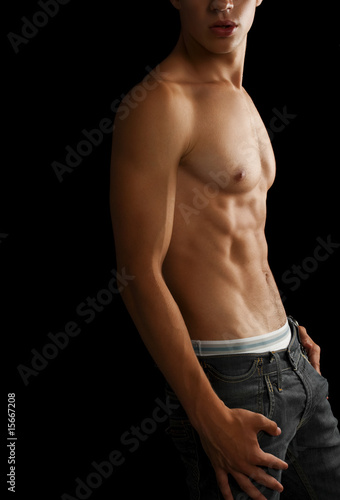 Muscular male model posing in studio