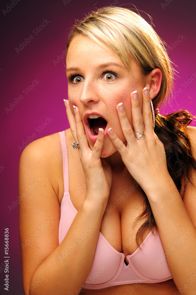 The astonished attractive young woman in the pink bra The astonished attractive young woman in the pink bra