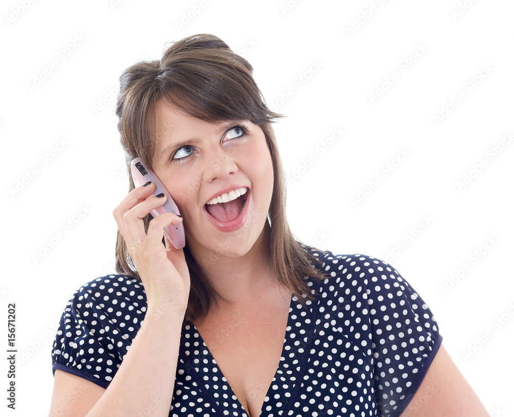 Happy young woman on her cell phone; isolated on a white Happy young woman on her cell phone; isolated on a white