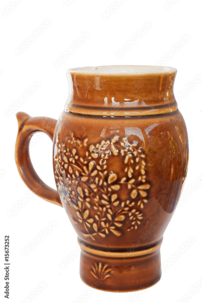 ceramic ornate beer mug on white