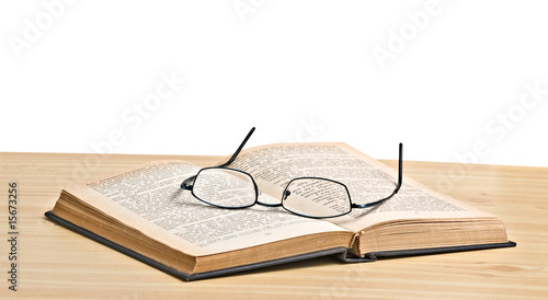 Glasses on open book photo