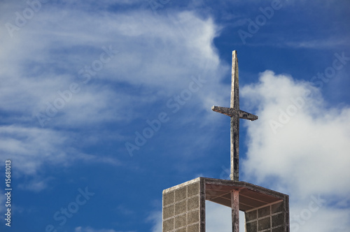 Old church's cross against blue sky