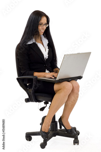 businesswoman with laptop in chair over white