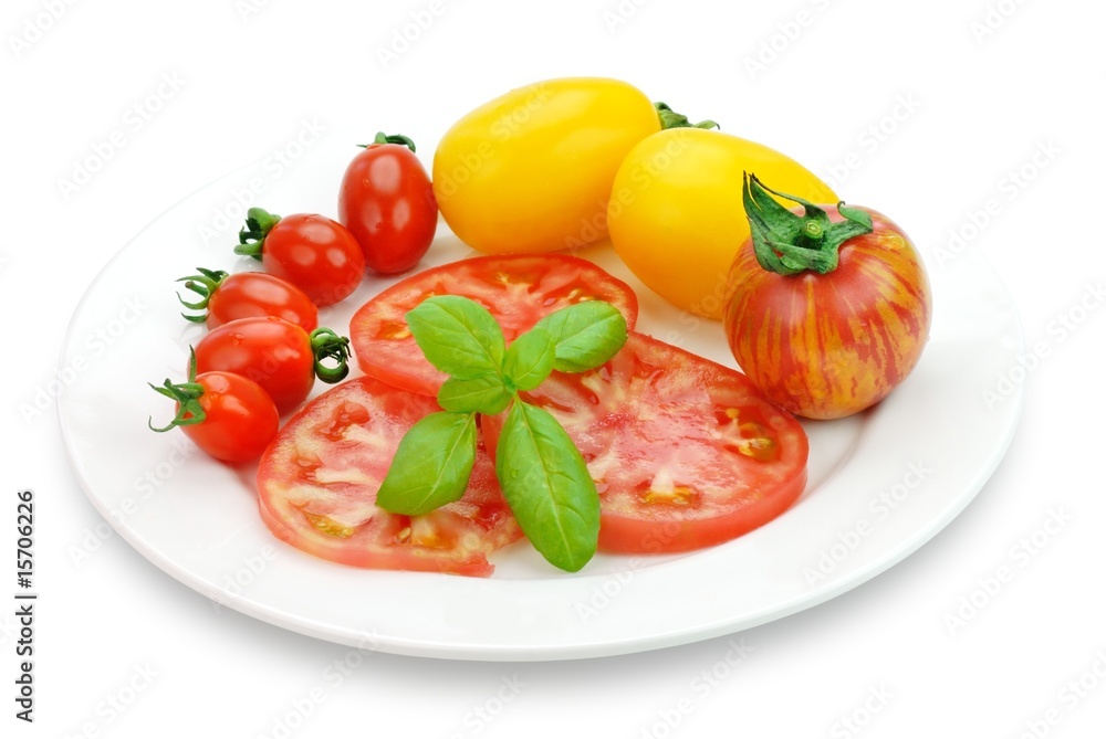 Tomato with Basil Leaf in White Plate Tomato with Basil Leaf in White Plate
