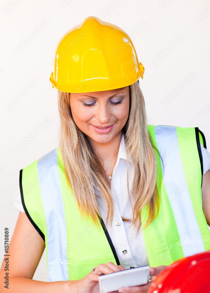 Worker with hard hat looking at drawing Worker with hard hat looking at drawing