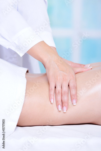 Beautician’s hands doing back massage