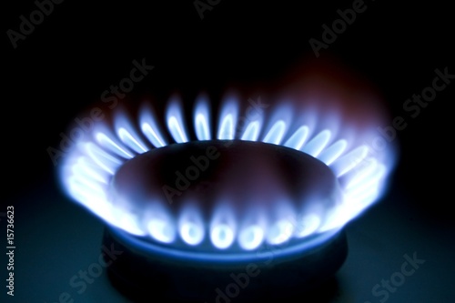 Close up of a gas burner isolated on black background