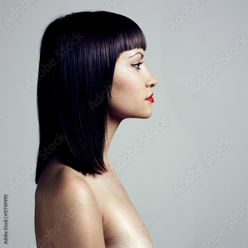 Profile of woman with strict hairstyle photo