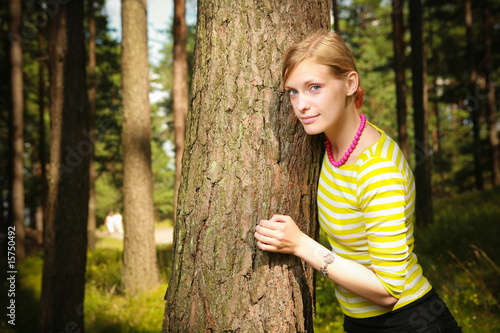 Girl standing near tree