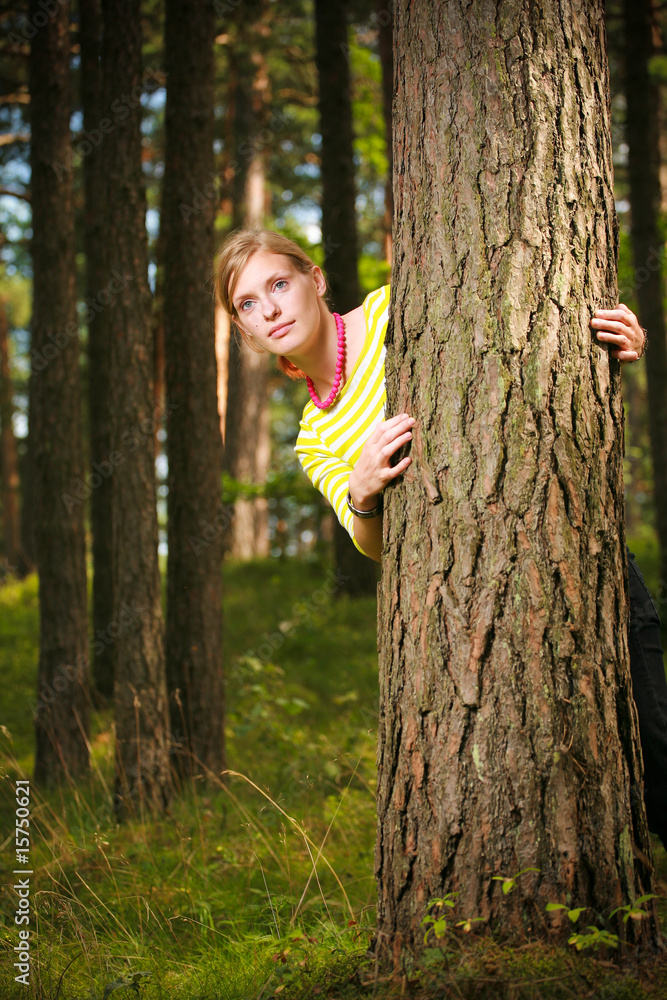 Girl standing near tree Girl standing near tree