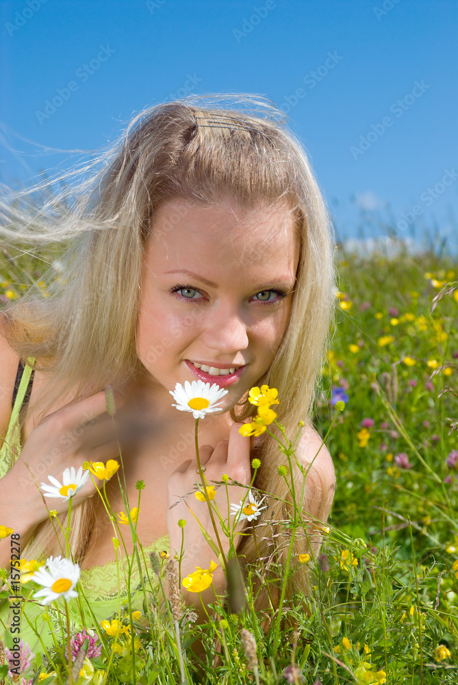 Sexy blonde on green meadow with camomile Sexy blonde on green meadow with camomile