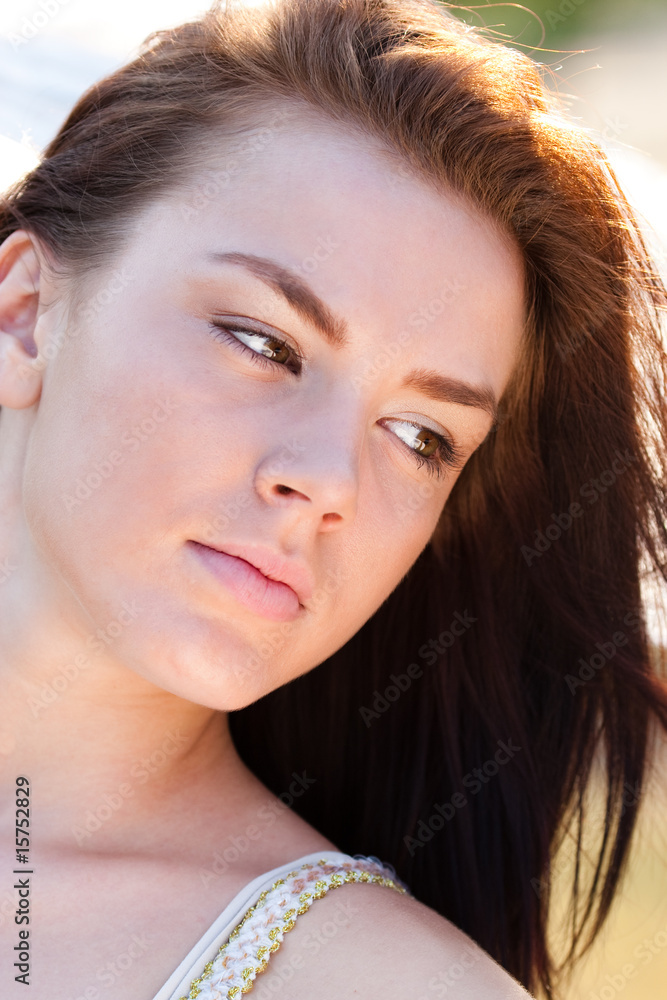 Naklejka premium Portrait of a beautiful woman looking down